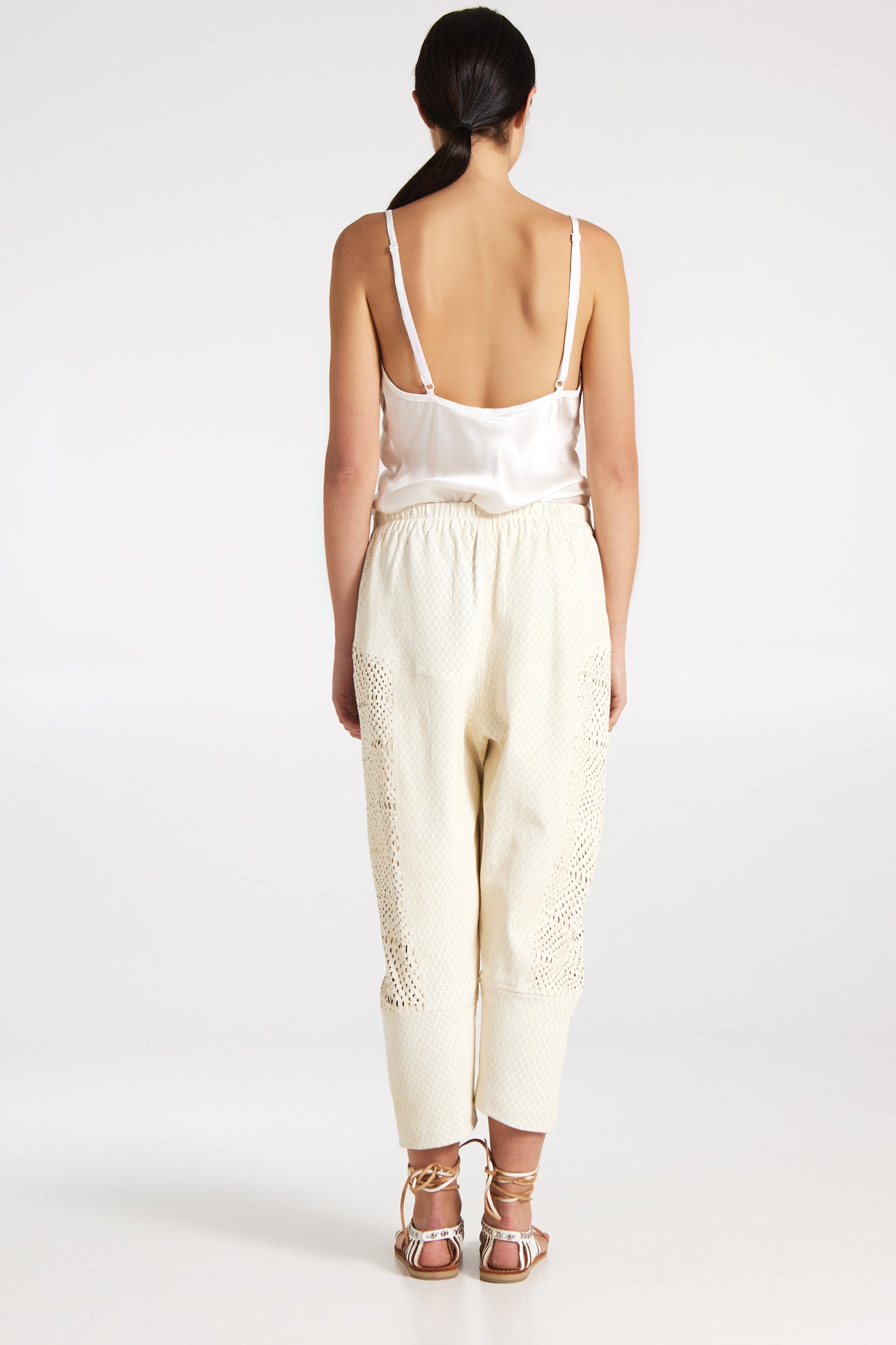 Perforated leather trousers