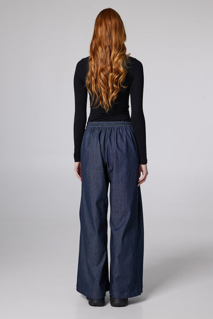 Wide Denim Trousers With Pockets And Front Pleats